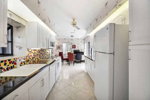 14 Windsor Ln, Boynton Beach, FL 33436 - kitchen with white appliances, dark countertops, ceiling fan, white cabinetry, and a sink