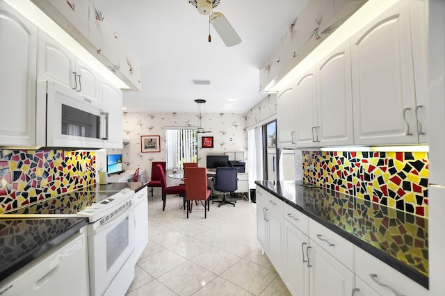 14 Windsor Ln, Boynton Beach, FL 33436 - kitchen with white appliances, dark countertops, ceiling fan, white cabinetry, and pendant lighting