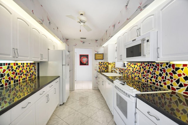 14 Windsor Ln, Boynton Beach, FL 33436 - kitchen with white appliances, a sink, dark countertops, backsplash, and ceiling fan