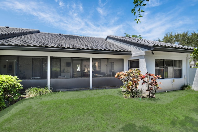 14 Windsor Ln, Boynton Beach, FL 33436 - rear view of property featuring a tiled roof, a lawn, a sunroom, and stucco siding