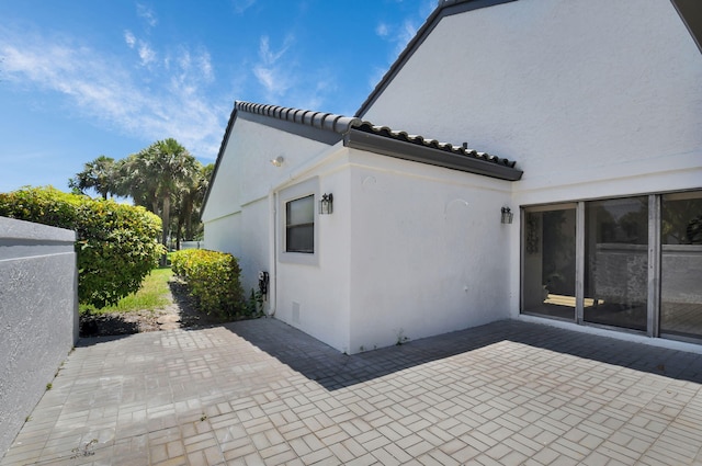 14 Windsor Ln, Boynton Beach, FL 33436 - back of house with a patio and stucco siding