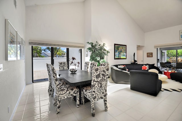 14 Windsor Ln, Boynton Beach, FL 33436 - dining room featuring high vaulted ceiling, tile patterned flooring, and baseboards