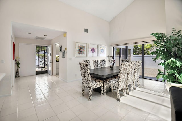 14 Windsor Ln, Boynton Beach, FL 33436 - dining space with a high ceiling, baseboards, and light tile patterned flooring