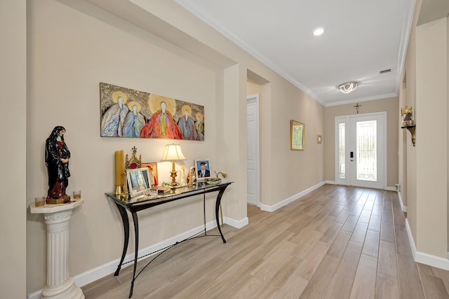 1055 Ember Ridge Run, Loxahatchee, FL 33470 - foyer featuring ornamental molding, baseboards, and light wood finished floors