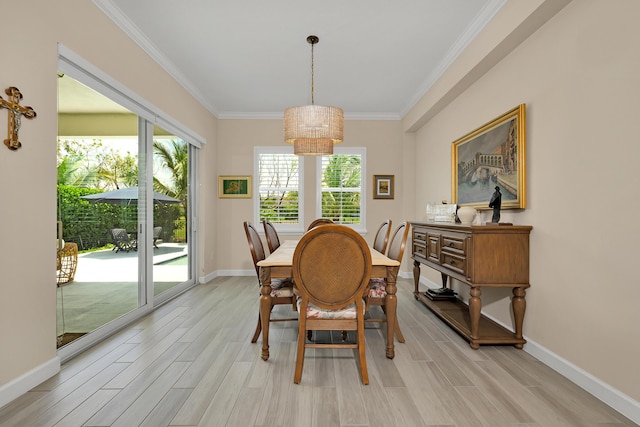1055 Ember Ridge Run, Loxahatchee, FL 33470 - dining space featuring a chandelier, light wood-type flooring, crown molding, and baseboards