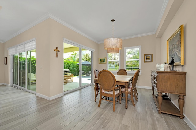 1055 Ember Ridge Run, Loxahatchee, FL 33470 - dining space featuring plenty of natural light, light wood finished floors, a chandelier, baseboards, and ornamental molding