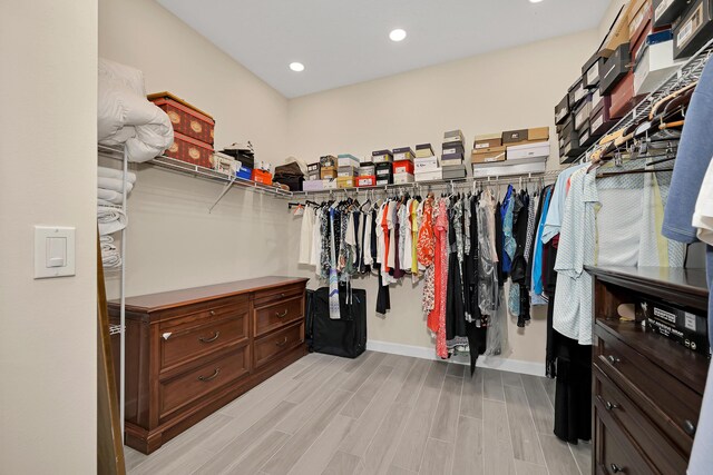 1055 Ember Ridge Run, Loxahatchee, FL 33470 - walk in closet featuring wood finished floors
