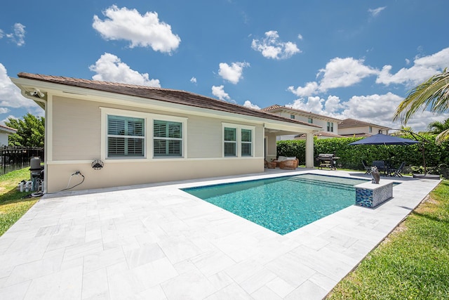 1055 Ember Ridge Run, Loxahatchee, FL 33470 - view of swimming pool with a patio area, fence, and area for grilling
