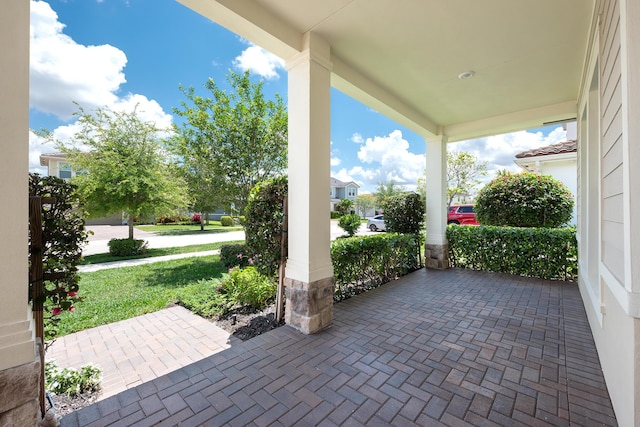1055 Ember Ridge Run, Loxahatchee, FL 33470 - view of patio featuring a porch