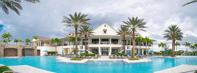 1055 Ember Ridge Run, Loxahatchee, FL 33470 - community pool with stairway and a patio