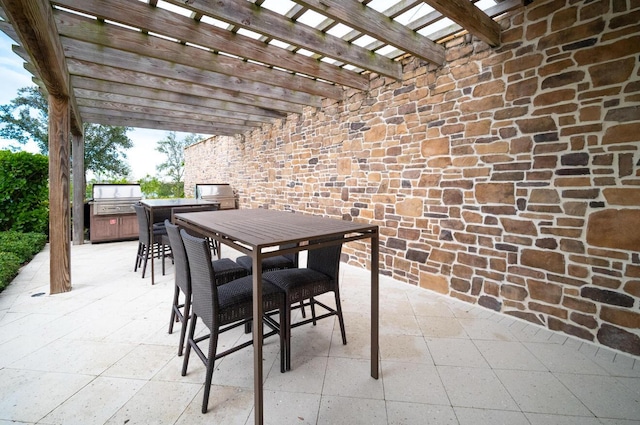 1055 Ember Ridge Run, Loxahatchee, FL 33470 - view of patio featuring a pergola, outdoor dining area, area for grilling, and exterior kitchen