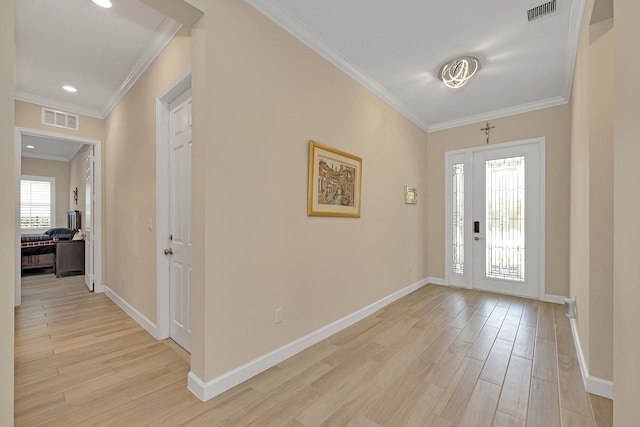1055 Ember Ridge Run, Loxahatchee, FL 33470 - foyer entrance featuring light wood-type flooring, ornamental molding, baseboards, and recessed lighting