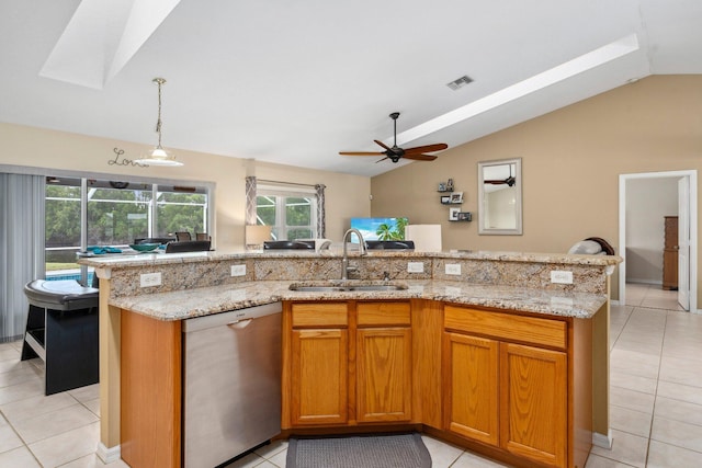kitchen featuring dishwasher, light tile patterned floors, lofted ceiling with skylight, visible vents, and a sink