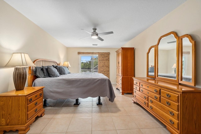 bedroom with light tile patterned floors, access to outside, and ceiling fan