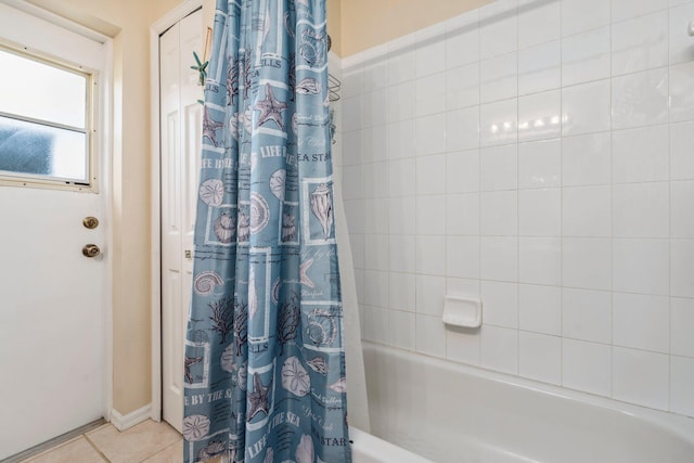 full bathroom with tile patterned flooring and shower / bathtub combination with curtain