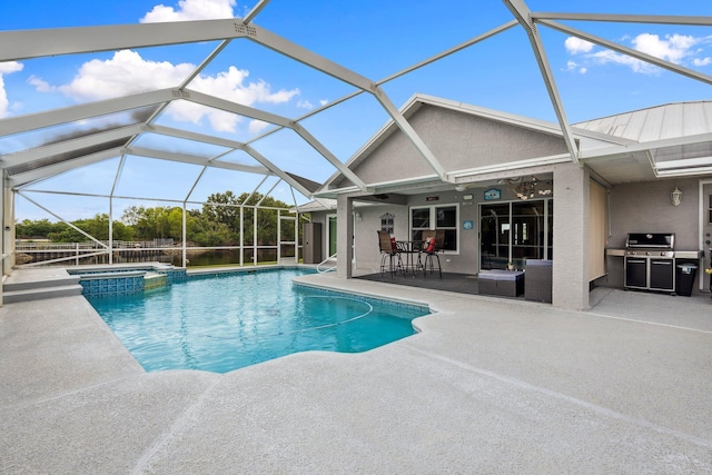 view of pool with a patio area, a pool with connected hot tub, grilling area, and a lanai