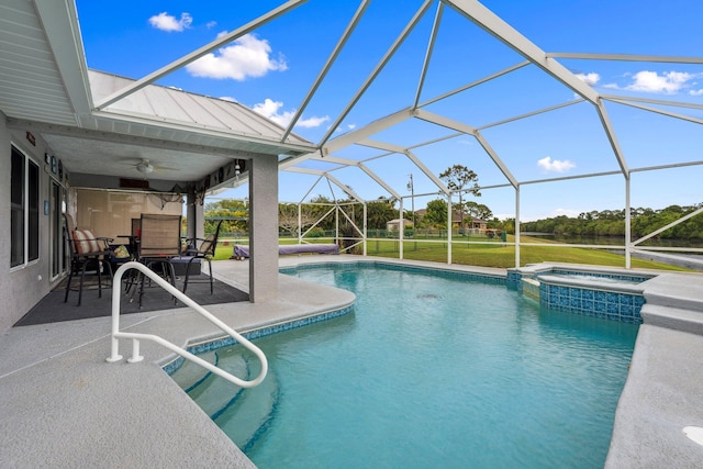 view of pool featuring a pool with connected hot tub, a patio area, a lanai, and a ceiling fan