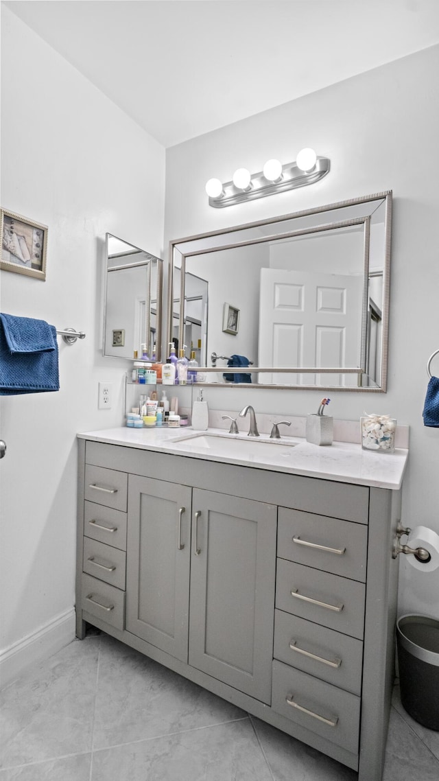 bathroom with baseboards and vanity