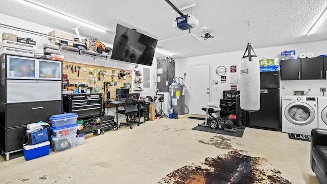 garage with water heater, a workshop area, a garage door opener, and washer and dryer