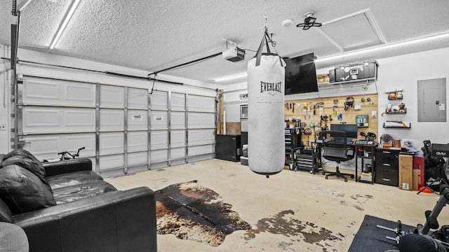garage featuring a garage door opener and electric panel