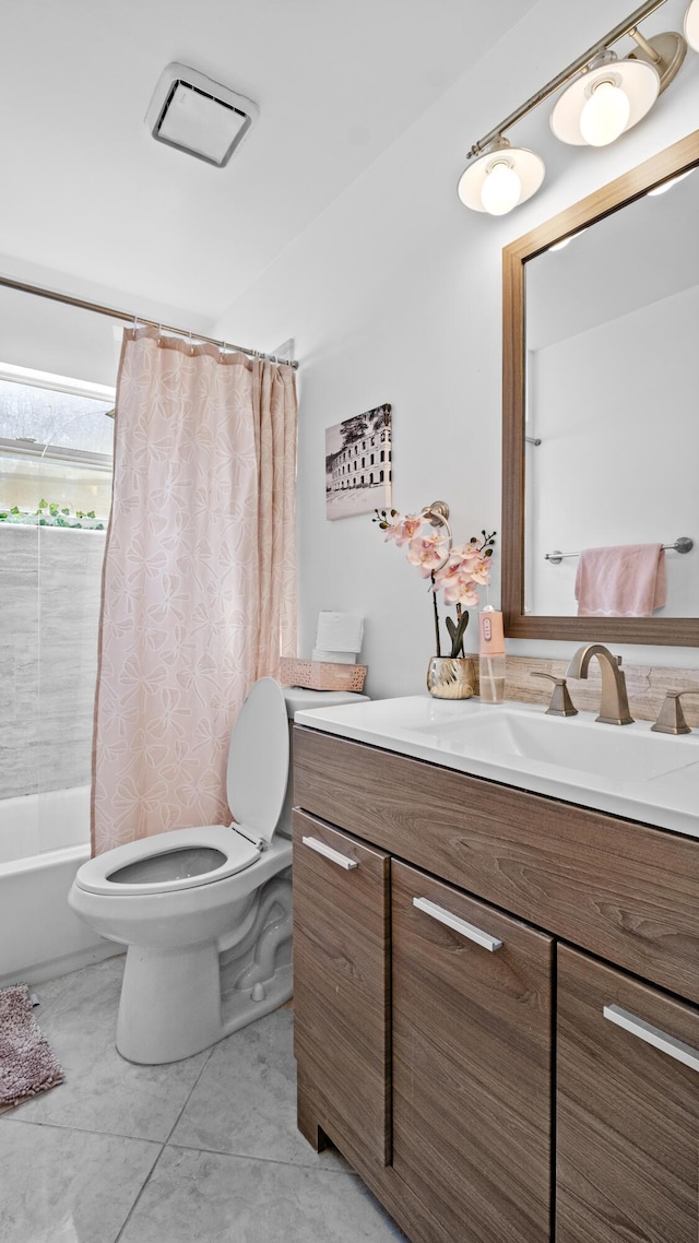 bathroom with vanity, toilet, and shower / tub combo