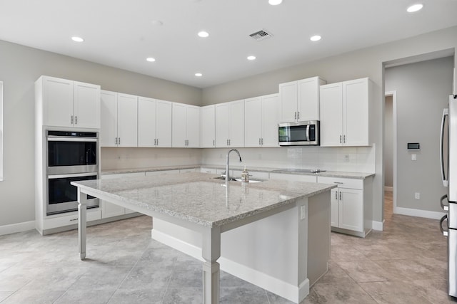 15816 Orchard Dr, Westlake, FL 33470 - kitchen featuring recessed lighting, a sink, stainless steel appliances, and visible vents