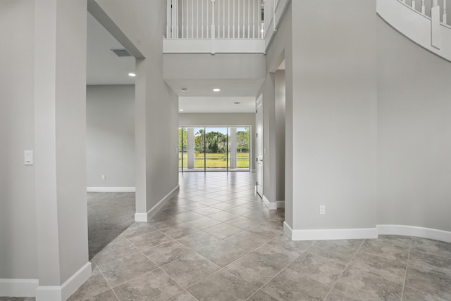 15816 Orchard Dr, Westlake, FL 33470 - entryway with recessed lighting, a high ceiling, visible vents, and baseboards