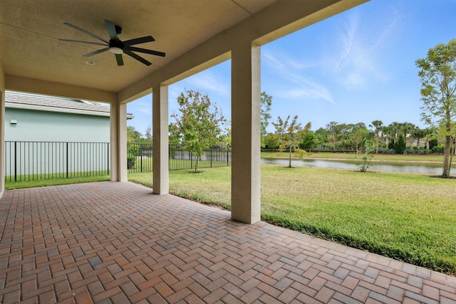 15816 Orchard Dr, Westlake, FL 33470 - view of patio featuring ceiling fan, a water view, and fence