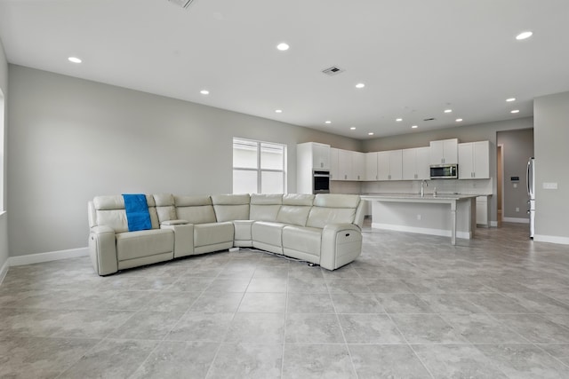 15816 Orchard Dr, Westlake, FL 33470 - living area featuring light tile patterned floors, recessed lighting, and visible vents