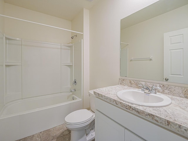 full bathroom featuring washtub / shower combination, vanity, and toilet