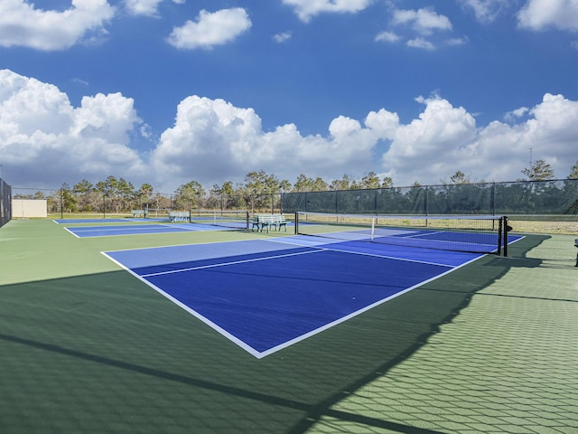 view of sport court featuring fence and community basketball court