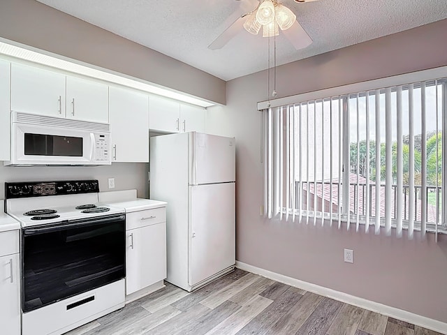 kitchen with white cabinetry, light wood-style flooring, white appliances, and light countertops