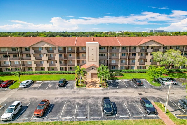 view of property with uncovered parking