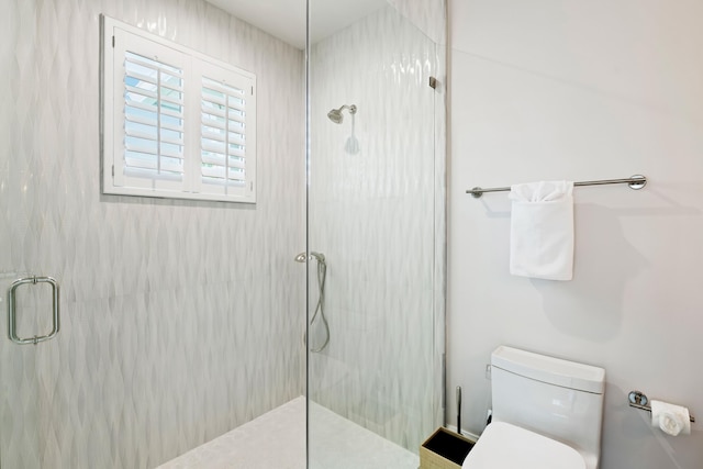full bathroom with an enclosed shower and toilet