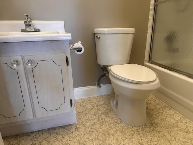363 Monaco H, Delray Beach, FL 33446 - bathroom featuring toilet, baseboards, enclosed tub / shower combo, and vanity