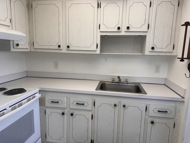 363 Monaco H, Delray Beach, FL 33446 - kitchen featuring a sink, white range with electric cooktop, light countertops, and under cabinet range hood