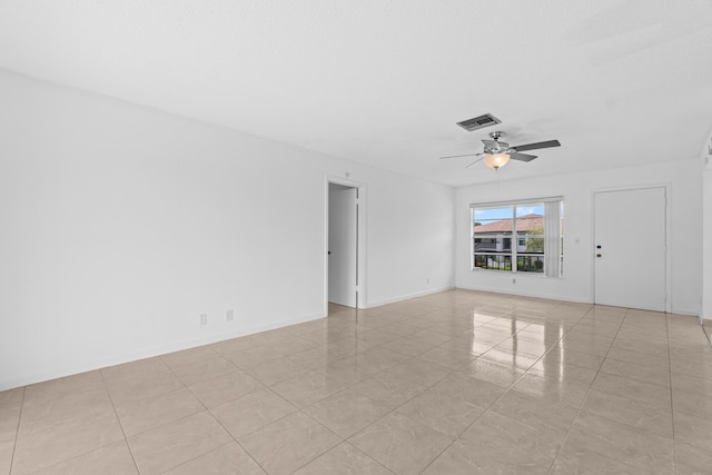 13648 Coconut Palm Ct Unit B, Delray Beach, FL 33484 - unfurnished room with light tile patterned floors, a ceiling fan, and visible vents