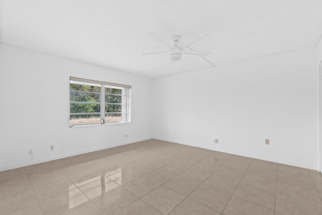 13648 Coconut Palm Ct Unit B, Delray Beach, FL 33484 - spare room with light tile patterned floors and a ceiling fan