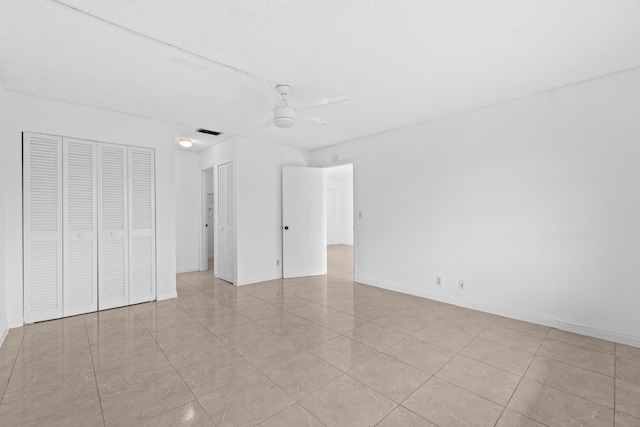 13648 Coconut Palm Ct Unit B, Delray Beach, FL 33484 - unfurnished bedroom featuring light tile patterned flooring, visible vents, ceiling fan, and baseboards