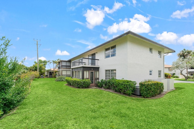 13648 Coconut Palm Ct Unit B, Delray Beach, FL 33484 - rear view of house with stucco siding, cooling unit, and a yard