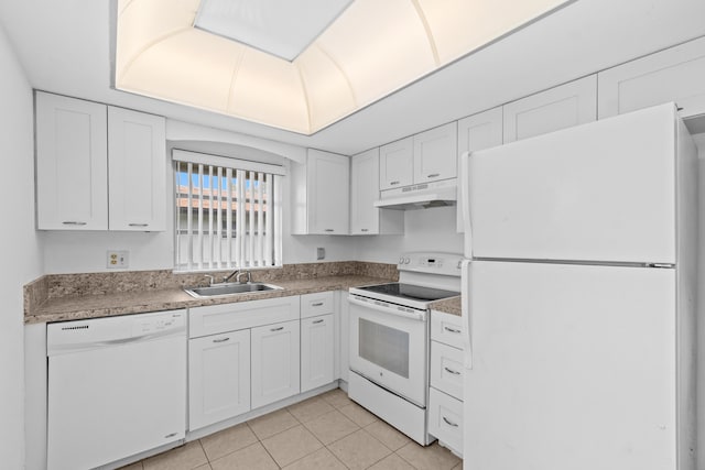 13648 Coconut Palm Ct Unit B, Delray Beach, FL 33484 - kitchen featuring light tile patterned floors, white cabinets, a sink, under cabinet range hood, and white appliances