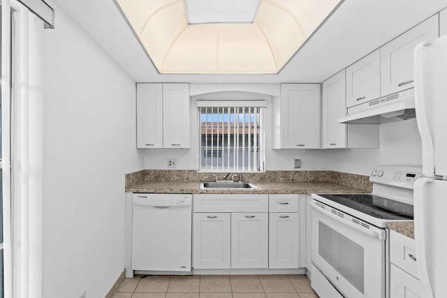 13648 Coconut Palm Ct Unit B, Delray Beach, FL 33484 - kitchen featuring light tile patterned floors, white cabinetry, a sink, under cabinet range hood, and white appliances