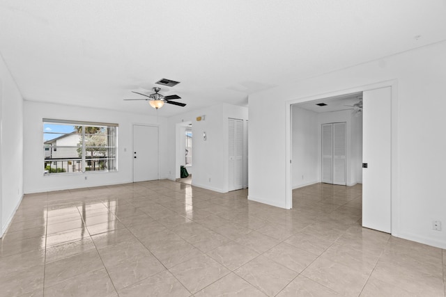 13648 Coconut Palm Ct Unit B, Delray Beach, FL 33484 - unfurnished living room featuring light tile patterned floors, visible vents, ceiling fan, and baseboards