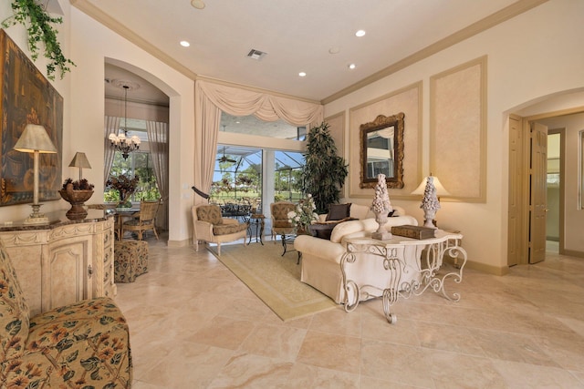 living room with visible vents, ornamental molding, baseboards, recessed lighting, and arched walkways