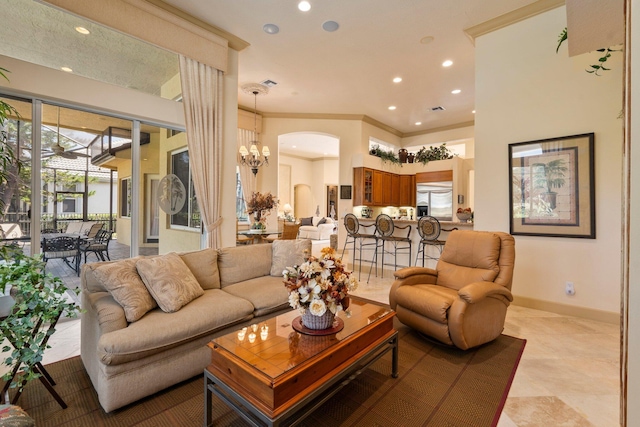 living area featuring recessed lighting, baseboards, and arched walkways