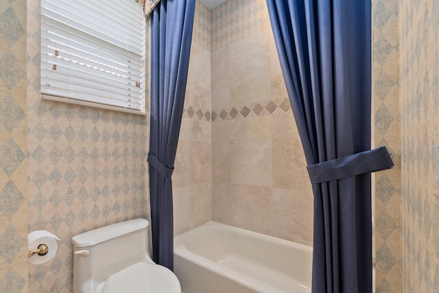 full bathroom with toilet and shower / bath combination with curtain