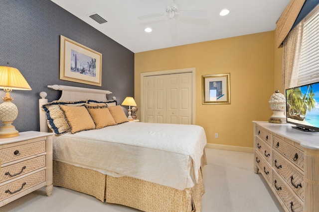 bedroom featuring visible vents, a closet, baseboards, recessed lighting, and light colored carpet