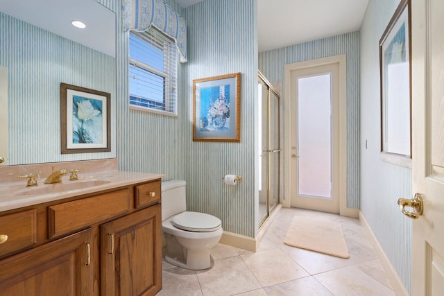 bathroom with tile patterned flooring, a shower stall, baseboards, toilet, and wallpapered walls