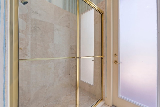 bathroom with a shower stall