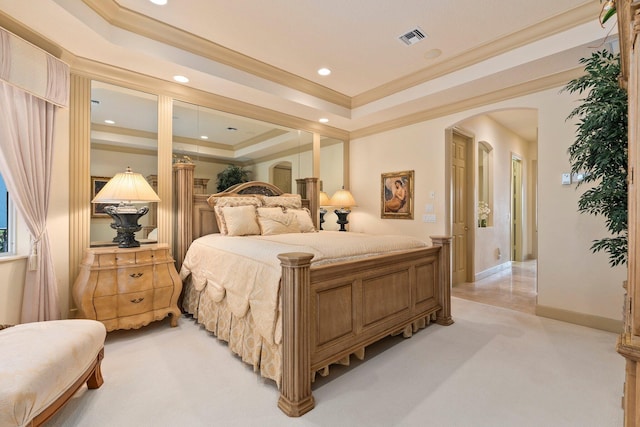 bedroom with visible vents, ornamental molding, recessed lighting, a tray ceiling, and arched walkways